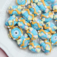 White beads blue cream yellow ripple