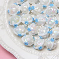 white beads and blue flowers