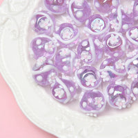 Purple beads sticky white flowers