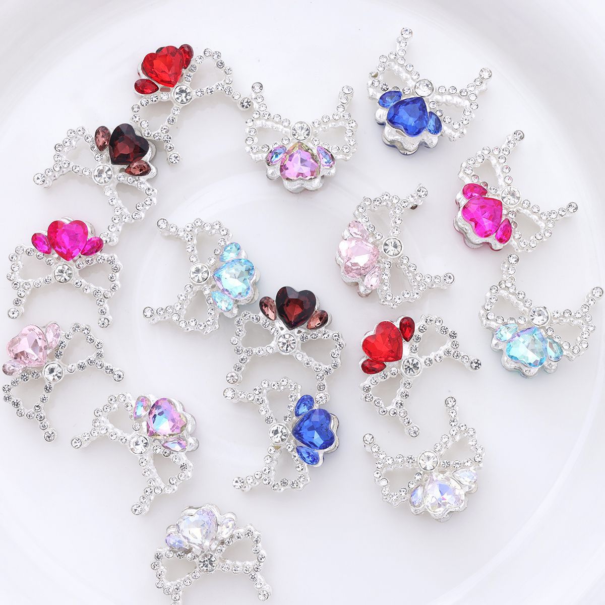 Alloy Bow Crown with Straight-hole Beads Featuring Colorful Heart-shaped Diamonds and Small Rhinestones.