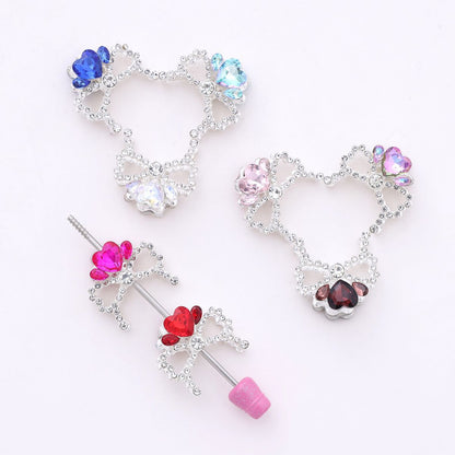 Alloy Bow Crown with Straight-hole Beads Featuring Colorful Heart-shaped Diamonds and Small Rhinestones.