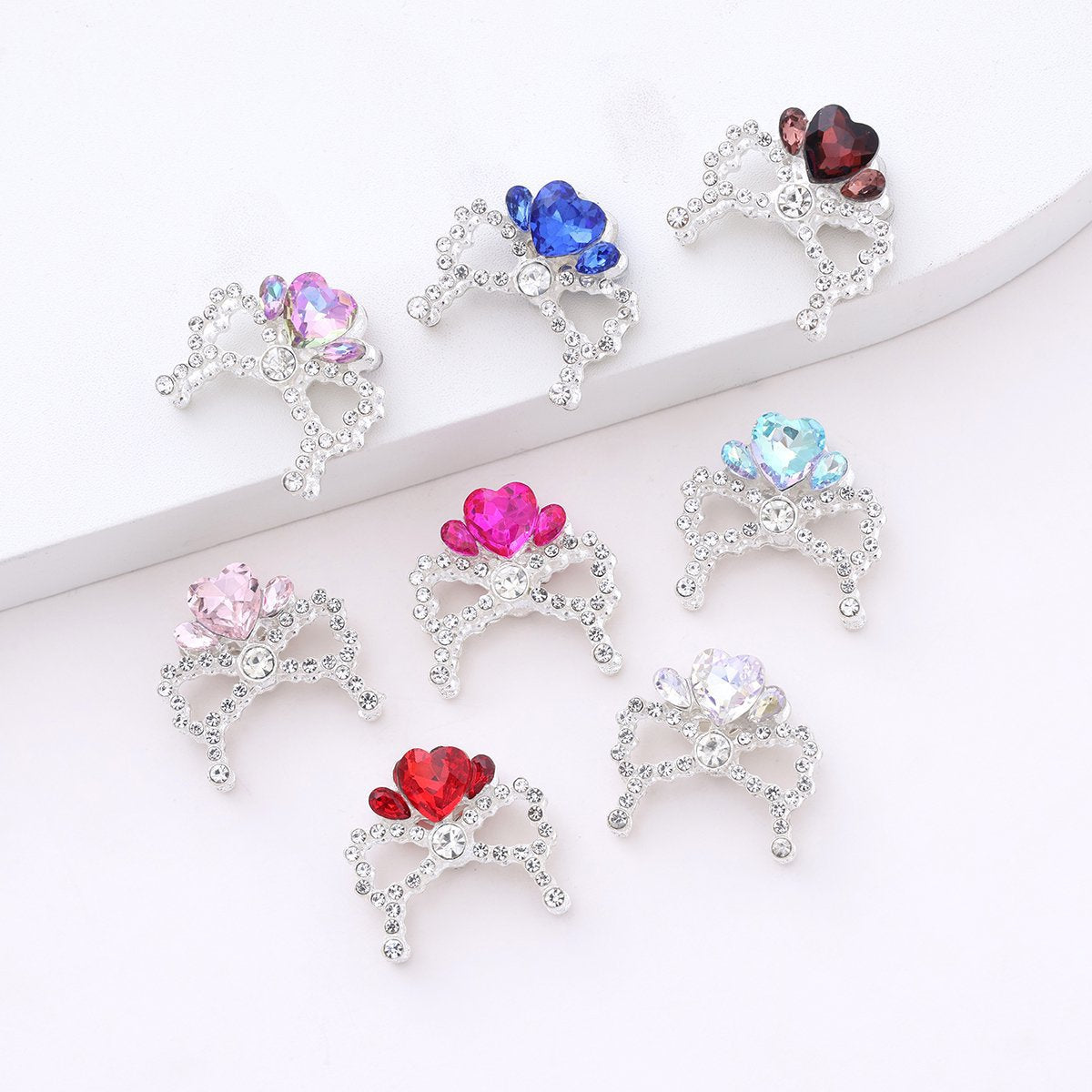 Alloy Bow Crown with Straight-hole Beads Featuring Colorful Heart-shaped Diamonds and Small Rhinestones.