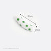 White with green dots